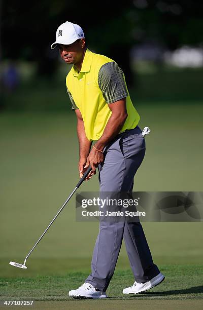 Tiger Woods makes bogey on the 11th hole during the weather-delayed first round of the World Golf Championships-Cadillac Championship at Trump...