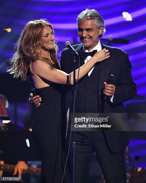 Singers Celine Dion and Andrea Bocelli embrace after performing during the 19th annual Keep Memory Alive "Power of Love Gala" benefit for the...