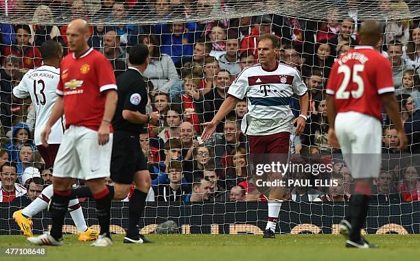 Bayern Munich legend Alexander Zickler celebrates scoring Bayern's first goal during the friendly football match between Manchester United's Legends...