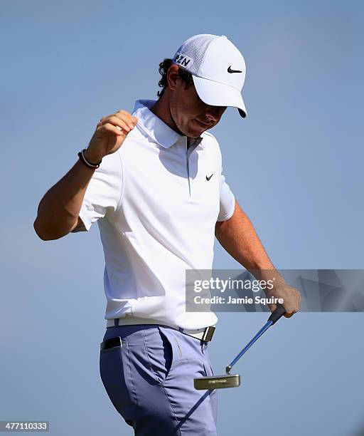 Rory McIlroy of Northern Ireland reacts to a bogey on the ninth hole during the weather-delayed first round of the World Golf Championships-Cadillac...