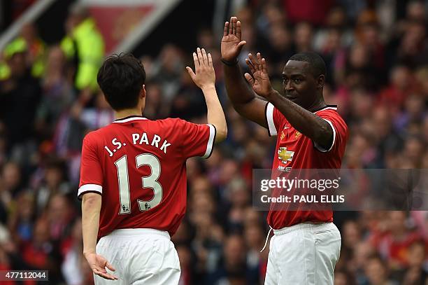 Manchester Utd legend Andy Cole celebrates scoring United's third goal with Manchester Utd legend Park Ji-Sung during the friendly football match...