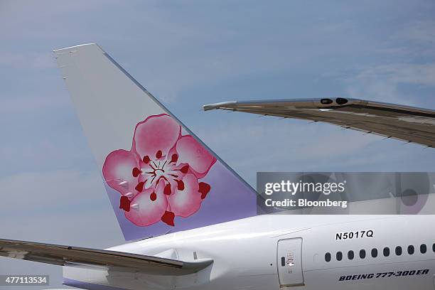 China Airlines Ltd. Logo sits on the tail fin of a Boeing 777-300ER aircraft, manufactured by Boeing Inc., at the 51st International Paris Air Show...