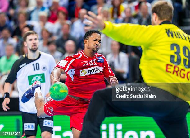 Raul Santos of Austria challenges goalkeeper Andreas Wolff of Germany during the European Handball Championship 2016 Qualifier between Germany and...