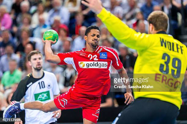 Raul Santos of Austria challenges goalkeeper Andreas Wolff of Germany during the European Handball Championship 2016 Qualifier between Germany and...