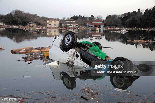 Truck sunk in the flooed by the tsunami triggered bya 9.0 magnitude strong earthquake on March 12, 2011 in Soma, Fukushima, Japan. The quake struck...