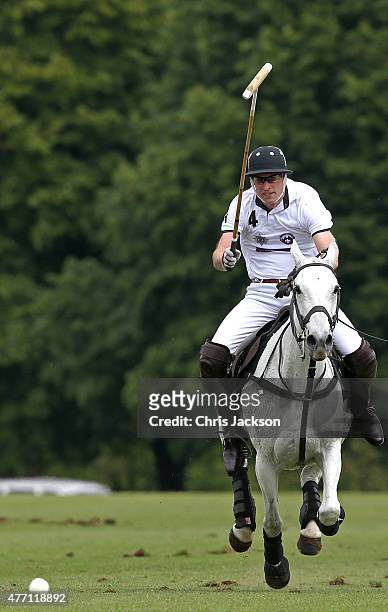Prince William, Duke of Cambridge plays for team Piaget as he competes in the Gigaset Charity Polo Match at Beaufort Polo Club on June 14, 2015 in...
