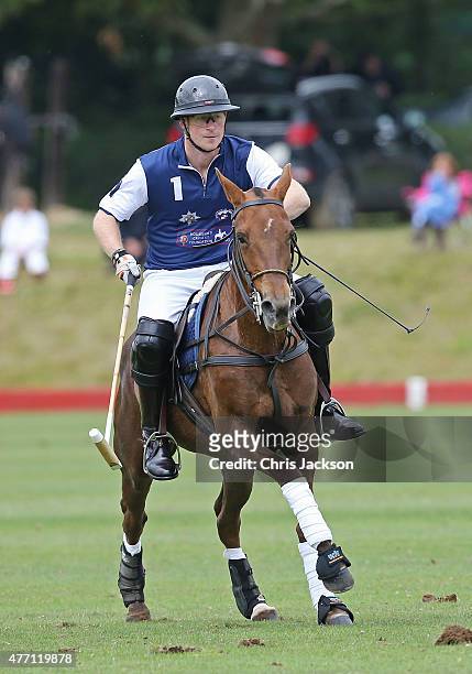 Prince Harry competes for team Royal Salute during the Gigaset Charity Polo Match at Beaufort Polo Club on June 14, 2015 in Tetbury, England.