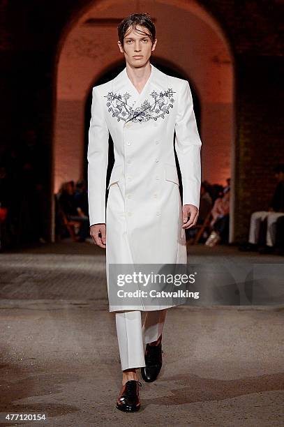 Model walks the runway at the Alexander McQueen Spring Summer 2016 fashion show during London Menswear Fashion Week on June 14, 2015 in London,...