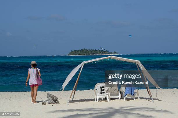 People enjoy a day on the sandy beach with the sea in the background on January 24, 2014 in San Andres, Colombia. Colombia has a territorial dispute...