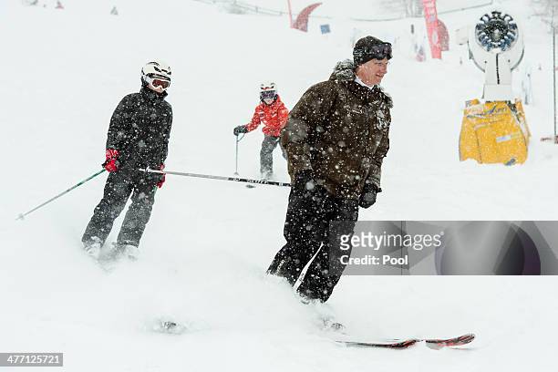 King Philippe of Belgium with Prince Emmanuel and Prince Gabriel ski during their winter holiday on March 3, 2014 in Verbier, Switzerland.