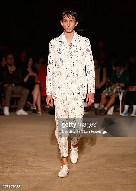 Model walks the runway at the Alexander McQueen show during The London Collections Men SS16 at The Arches on June 14, 2015 in London, England.