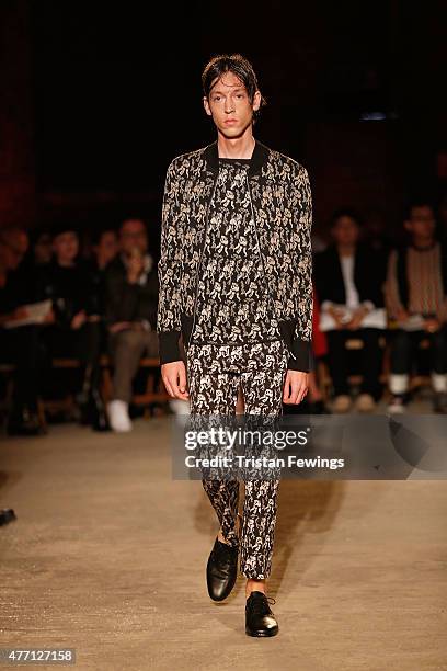 Model walks the runway at the Alexander McQueen show during The London Collections Men SS16 at The Arches on June 14, 2015 in London, England.