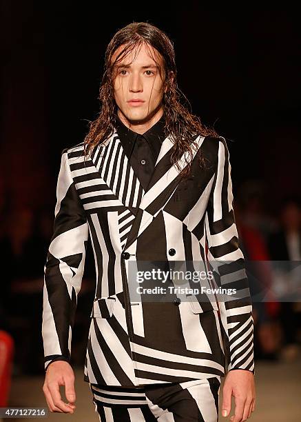 Model walks the runway at the Alexander McQueen show during The London Collections Men SS16 at The Arches on June 14, 2015 in London, England.