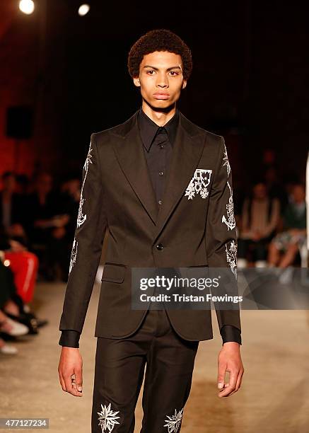 Model walks the runway at the Alexander McQueen show during The London Collections Men SS16 at The Arches on June 14, 2015 in London, England.