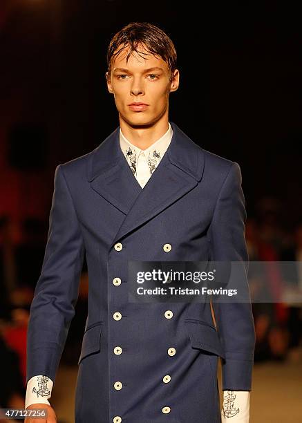 Model walks the runway at the Alexander McQueen show during The London Collections Men SS16 at The Arches on June 14, 2015 in London, England.