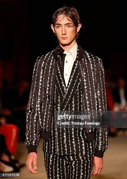 Model walks the runway at the Alexander McQueen show during The London Collections Men SS16 at The Arches on June 14, 2015 in London, England.