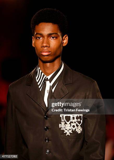 Model walks the runway at the Alexander McQueen show during The London Collections Men SS16 at The Arches on June 14, 2015 in London, England.