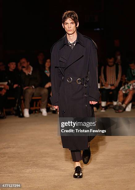 Model walks the runway at the Alexander McQueen show during The London Collections Men SS16 at The Arches on June 14, 2015 in London, England.