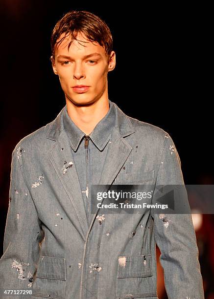 Model walks the runway at the Alexander McQueen show during The London Collections Men SS16 at The Arches on June 14, 2015 in London, England.