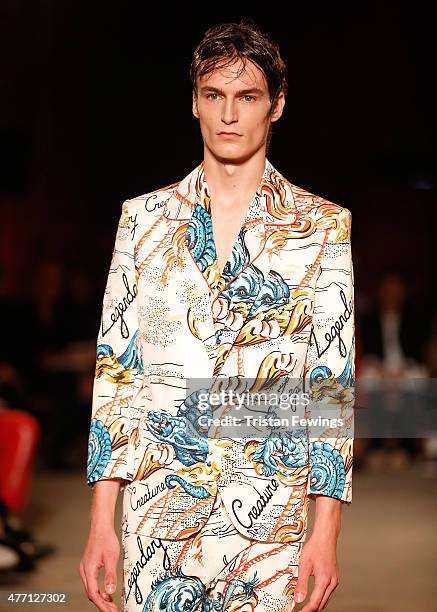 Model walks the runway at the Alexander McQueen show during The London Collections Men SS16 at The Arches on June 14, 2015 in London, England.