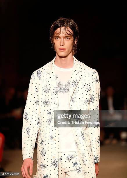 Model walks the runway at the Alexander McQueen show during The London Collections Men SS16 at The Arches on June 14, 2015 in London, England.