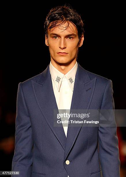 Model walks the runway at the Alexander McQueen show during The London Collections Men SS16 at The Arches on June 14, 2015 in London, England.