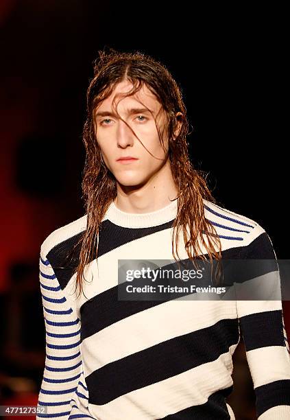 Model walks the runway at the Alexander McQueen show during The London Collections Men SS16 at The Arches on June 14, 2015 in London, England.