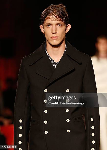 Model walks the runway at the Alexander McQueen show during The London Collections Men SS16 at The Arches on June 14, 2015 in London, England.