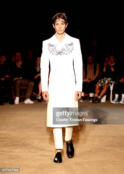 Model walks the runway at the Alexander McQueen show during The London Collections Men SS16 at The Arches on June 14, 2015 in London, England.