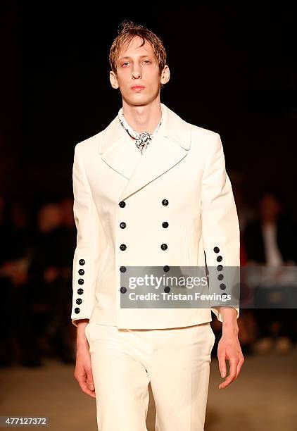 Model walks the runway at the Alexander McQueen show during The London Collections Men SS16 at The Arches on June 14, 2015 in London, England.