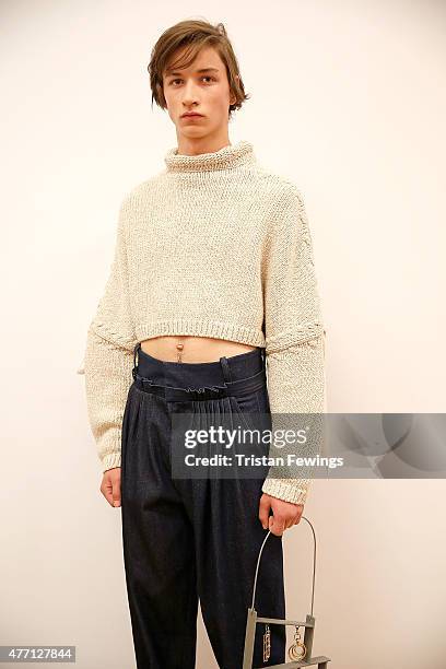 Model backstage at the J.W.Anderson show during The London Collections Men SS16 at Yeomanry House on June 14, 2015 in London, England.