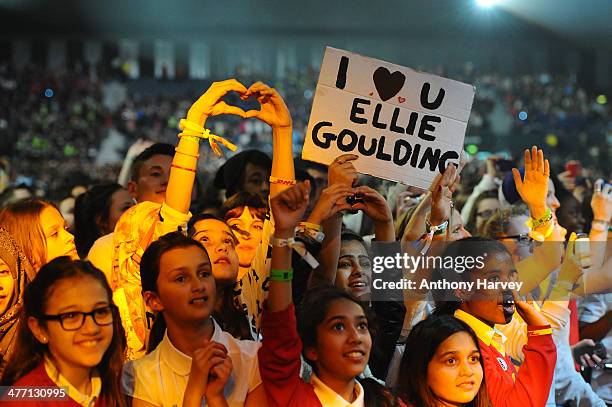 Member of the crowd holds up a sign as Free The Children hosts their debut UK global youth empowerment event, We Day at Wembley Arena on March 7,...