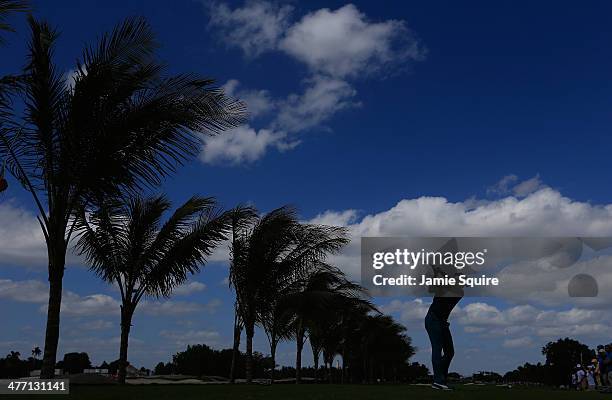 Ian Poulter of England hits his tee shot on the second hole during the second round of the World Golf Championships-Cadillac Championship at Trump...