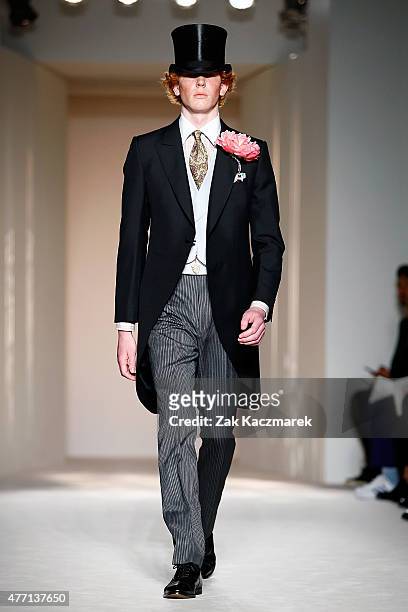 Model walks the runway at the dunhill show during The London Collections Men SS16 at Phillips Gallery on June 14, 2015 in London, England.