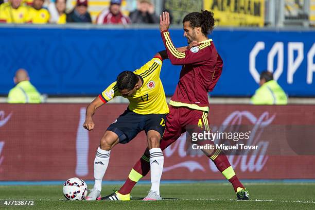 Carlos Bacca of Colombia fights for the ball with Oswaldo Vizcarrondo of Venezuela during the 2015 Copa America Chile Group C match between Colombia...