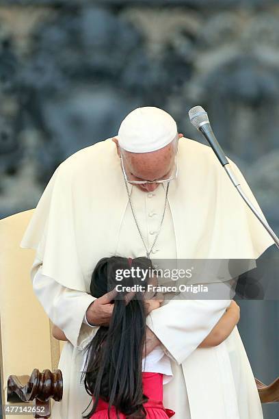 Pope Francis greets a baby during a meeting with the Roman Diocesans in St. Peter's Square on June 14, 2015 in Vatican City, Vatican. The Pontiff...