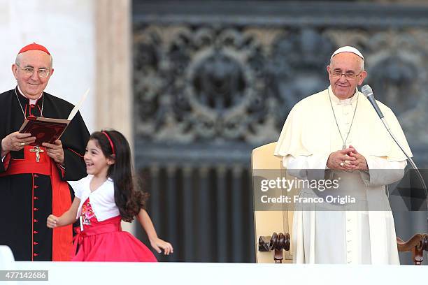 Pope Francis, flanked by Vicar General of Rome cardinal Agostino Vallini greets a baby during a meeting with the Roman Diocesans in St. Peter's...