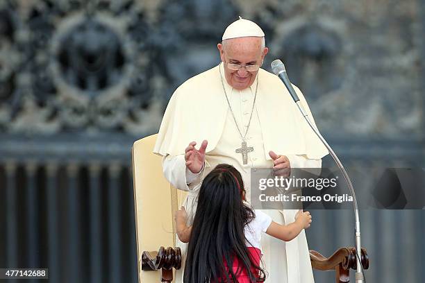 Pope Francis greets a baby during a meeting with the Roman Diocesans in St. Peter's Square on June 14, 2015 in Vatican City, Vatican. The Pontiff...