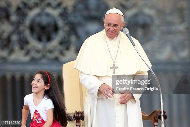 Pope Francis greets a baby during a meeting with the Roman Diocesans in St. Peter's Square on June 14, 2015 in Vatican City, Vatican. The Pontiff...