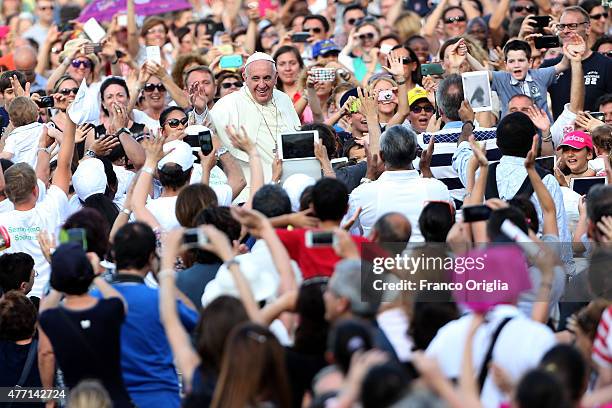 Pope Francis waves to the faithful as he arrives in St. Peter's Square for a meeting with the Roman Diocesans on June 14, 2015 in Vatican City,...