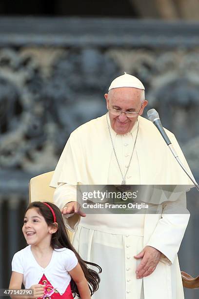 Pope Francis greets a baby during a meeting with the Roman Diocesans in St. Peter's Square on June 14, 2015 in Vatican City, Vatican. The Pontiff...