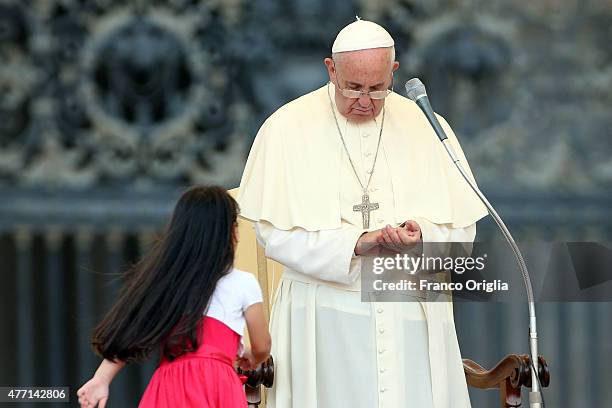 Pope Francis greets a baby during a meeting with the Roman Diocesans in St. Peter's Square on June 14, 2015 in Vatican City, Vatican. The Pontiff...