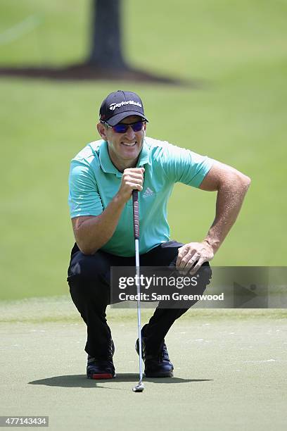 Greg Owen of England lines up a putt on the second hole during the final round of the FedEx St. Jude Classic at TPC Southwind on June 14, 2015 in...