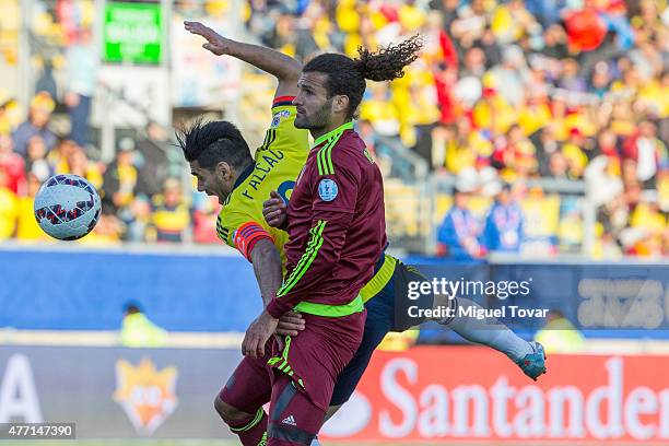 Radamel Falcao Garcia of Colombia fights for the ball with Oswaldo Vizcarrondo of Venezuela during the 2015 Copa America Chile Group C match between...