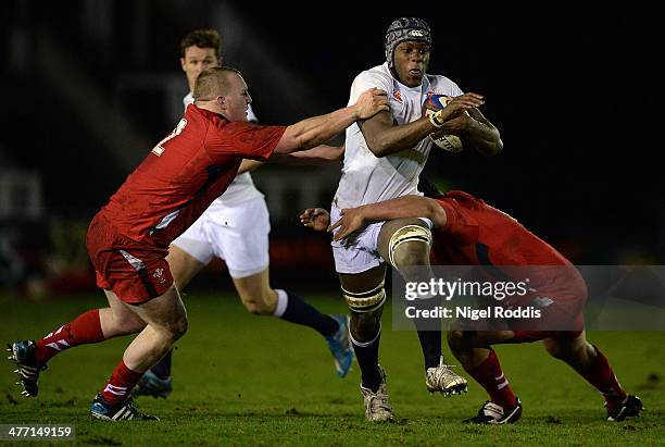 Maro Itoje of England is tackled by Ethan Lewis and Nicky Smith of Wales during the Six Nations International match between England U20 and Wales U20...