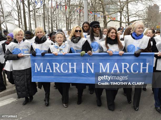 Cindy McCain, Trudy Styler, Ban Soon Taek, Kim Cattrall, Naomi Campbell and Uma Pemmaraju march from the United Nations March 7, 2014 during the UN...