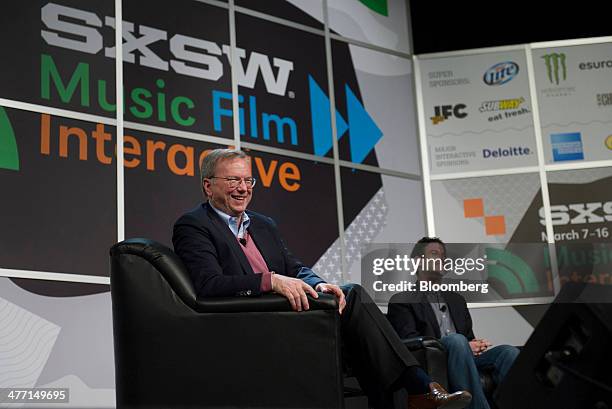 Eric Schmidt, executive chairman of Google Inc., left, and Jared Cohen, director of Google Ideas, laugh while speaking at the South By Southwest...