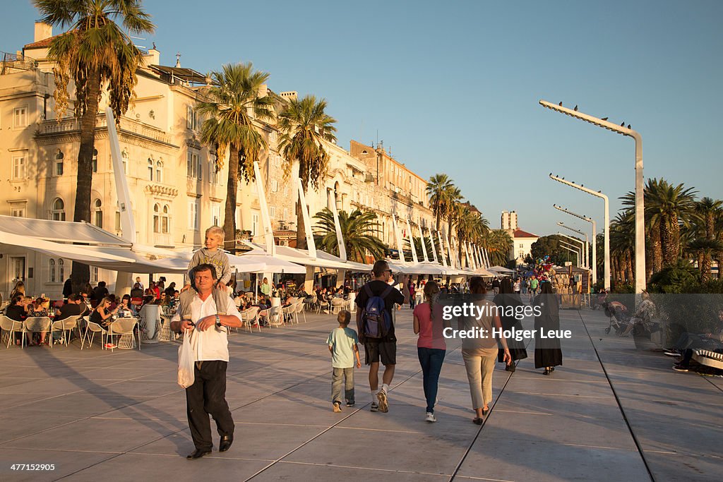 People at The Riva seafront promenade