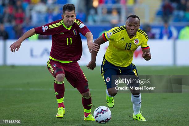 Cesar Gonzalez of Venezuela fights for the ball with Camilo Zuniga of Colombia during the 2015 Copa America Chile Group C match between Colombia and...