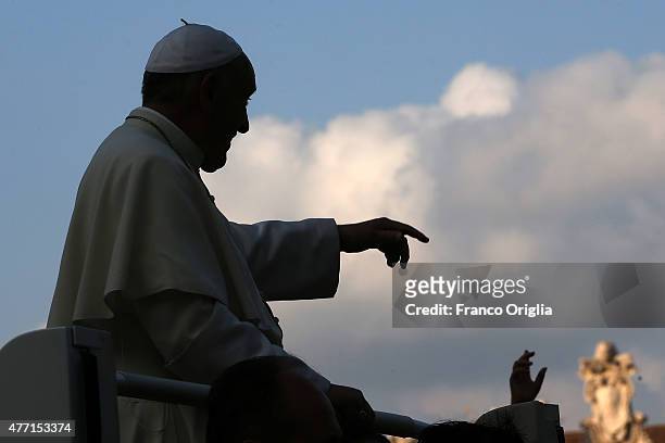 Pope Francis waves to the faithful as he arrives in St. Peter's Square for a meeting with the Roman Diocesans on June 14, 2015 in Vatican City,...